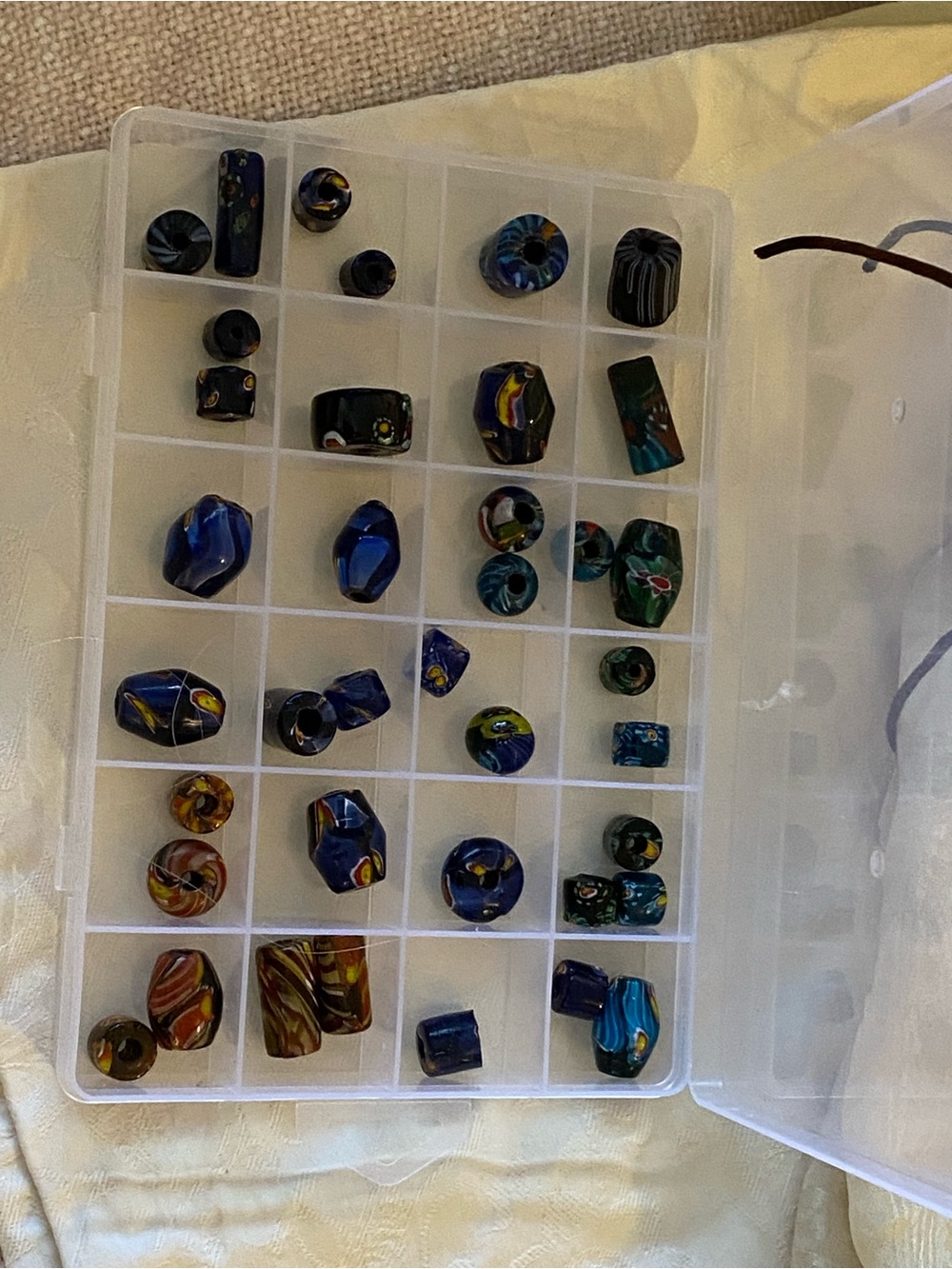 A mix of 38 non- glossed African beads and more modern glass versions.